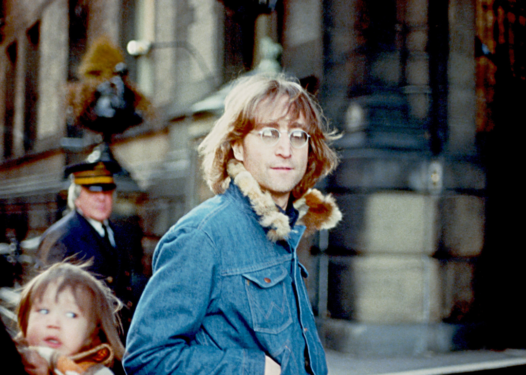 John Lennon, Yoko Ono and son Sean outside The Dakota.