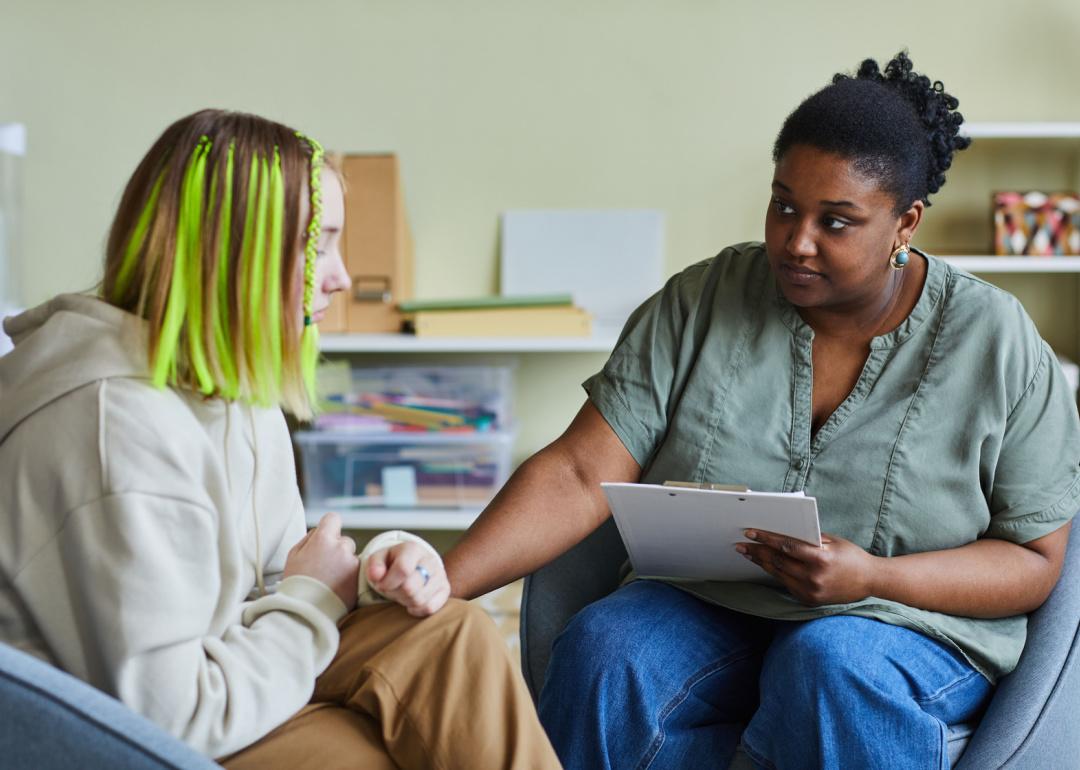 School psychologist supporting teen.