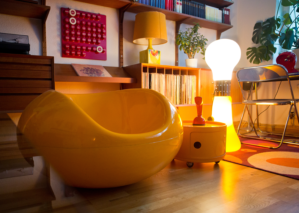 Birillo floor lamp, Componibili storage cabinet, and Pastille armchair in an apartment.