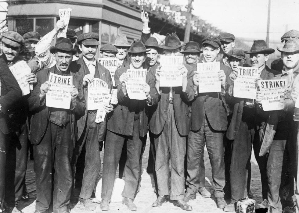 Workers holding strike signs at steel plant