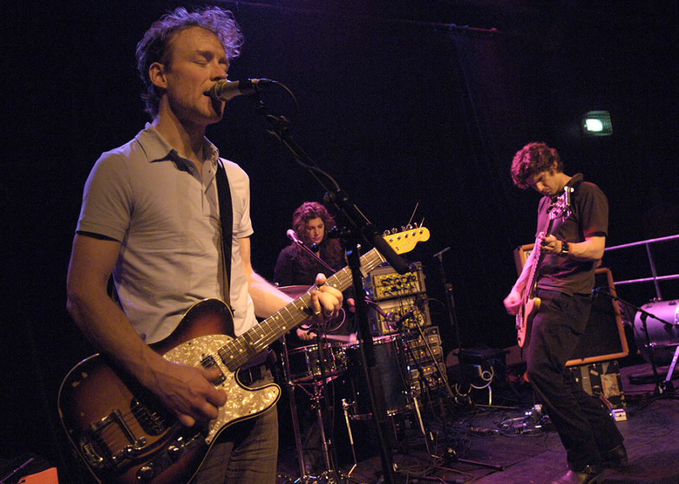 Alan Sparhawk, Mimi Parker, Matt Livingston perform onstage.