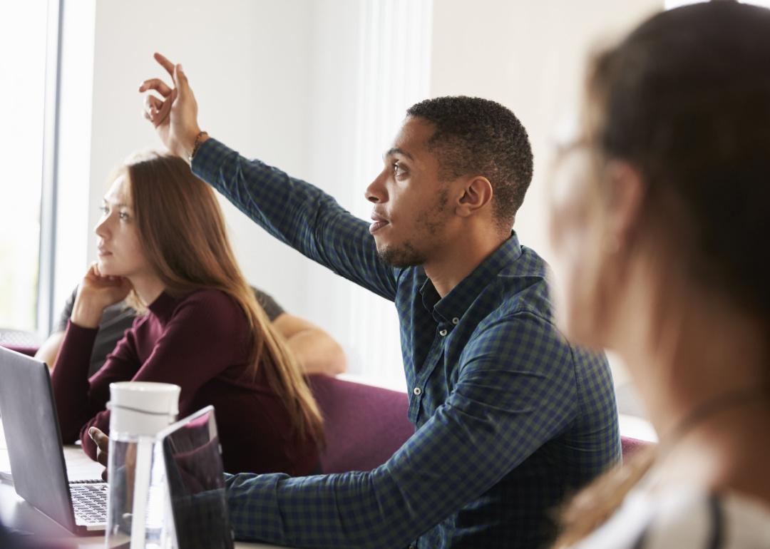 Student raises his hand in class