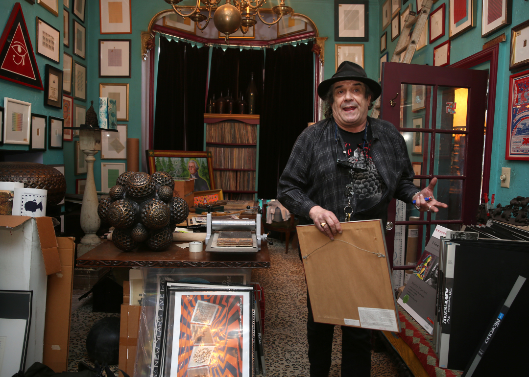 Mark McCloud talks to visitors about his Institute of Illegal Images.
