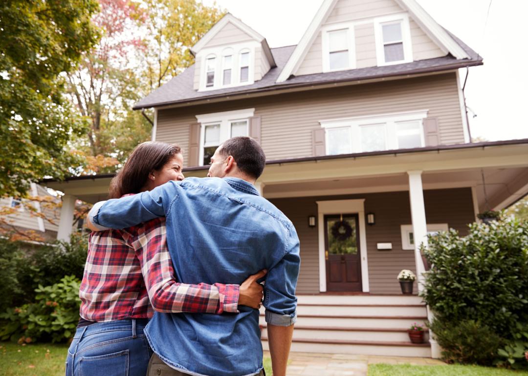 Couple walking toward house.