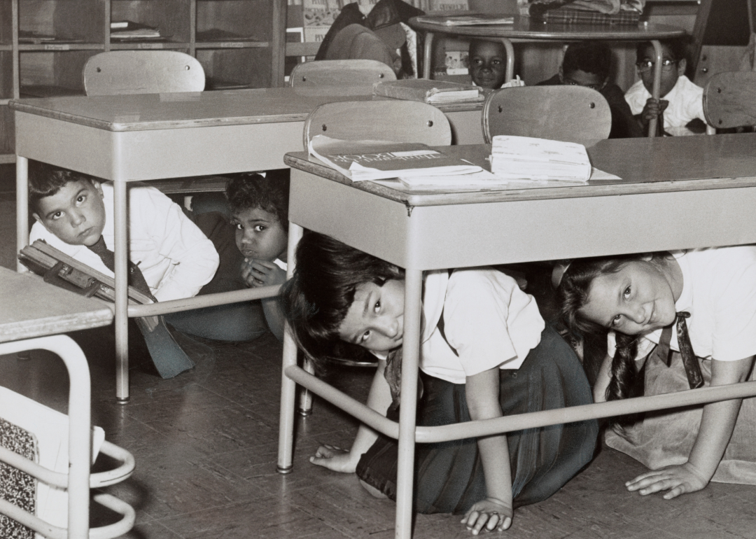 Students practice 'duck and cover' drill.