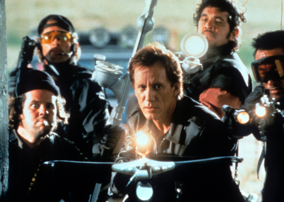 James Woods holds a crossbow with his crew in a scene from the film 'Vampires.'