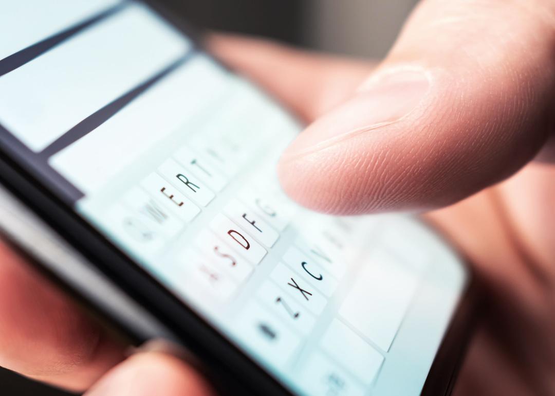 Person composing text message on phone.