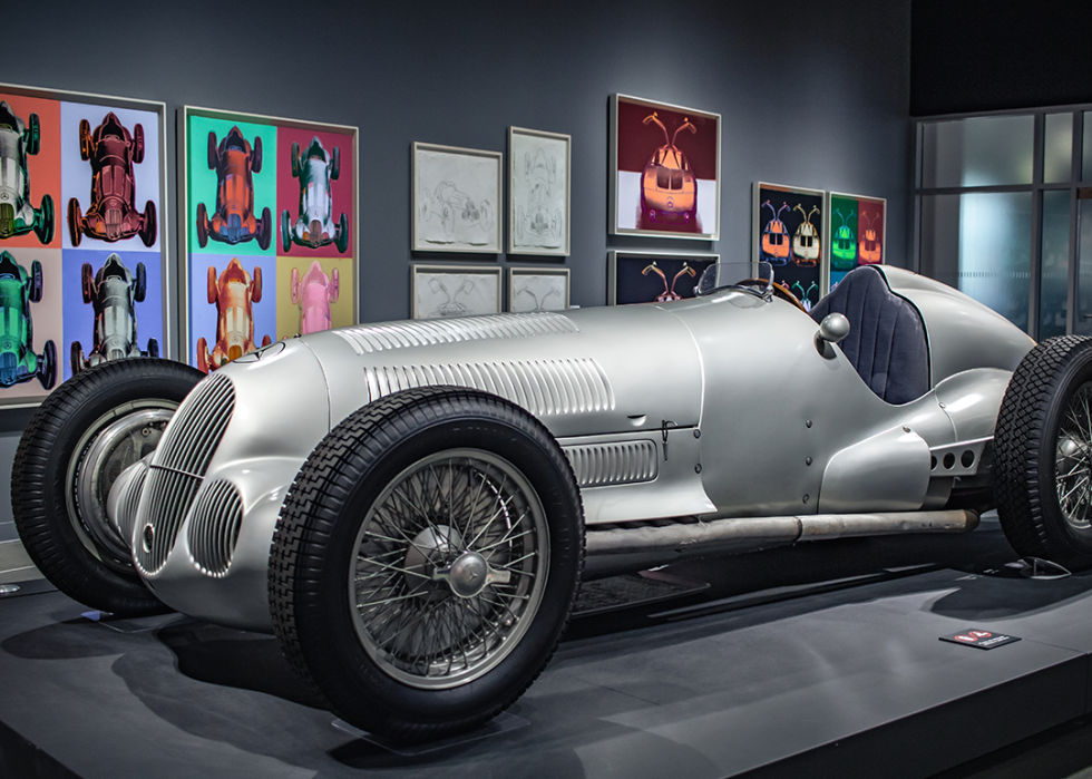 Silver Mercedes Benz on display inside.