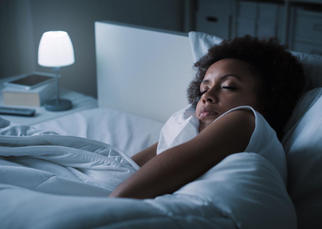 Person sleeping in bed.