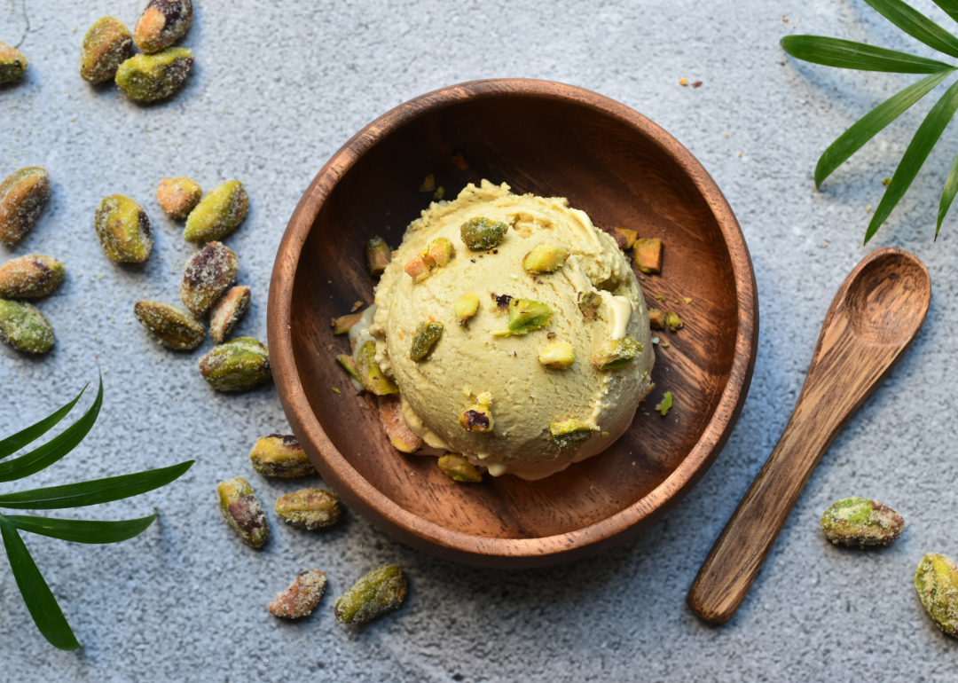 Wooden bowl of pistachio ice cream.