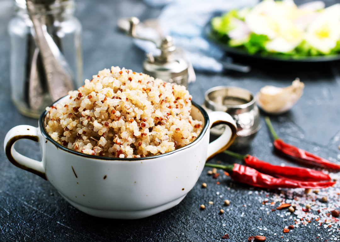 Quinoa in bowl on table.