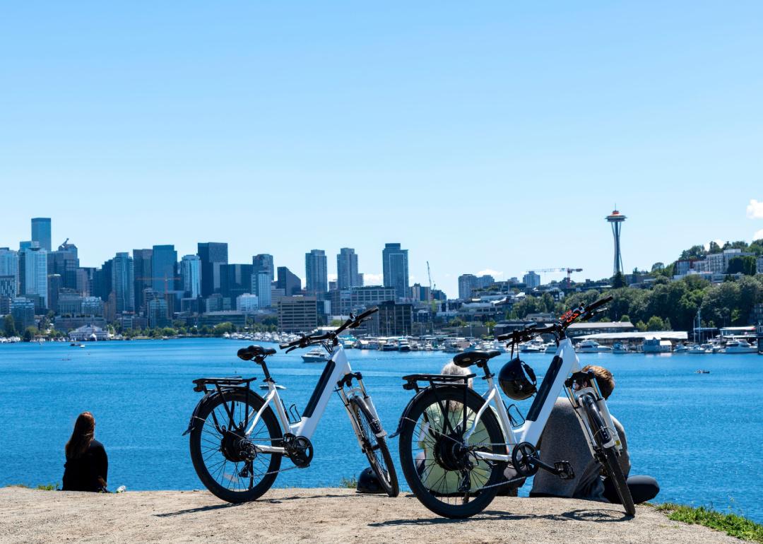 People with bicycles relax in Gas Works Park in Seattle