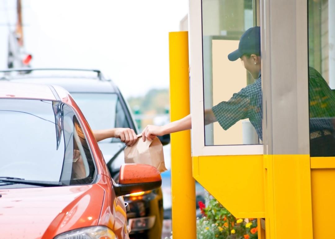 Person using drive thru at restaurant.