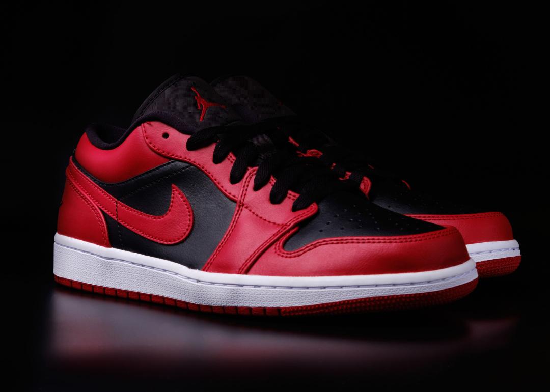 Pair of Air Jordan sneakers with black background.