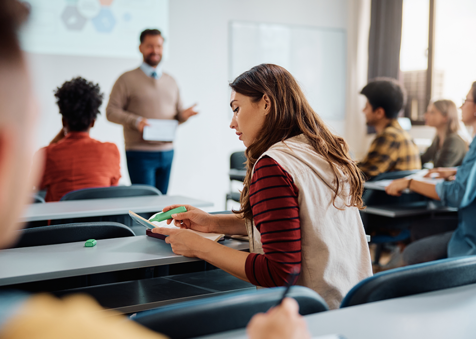 Students at desks in classroom.