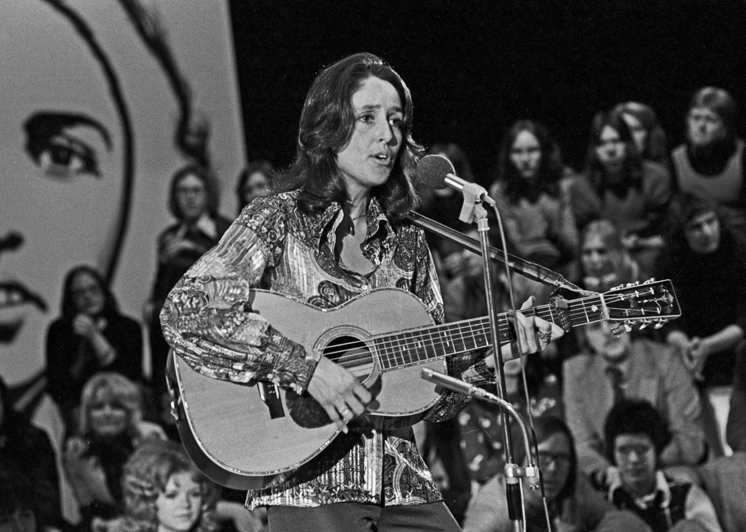 Joan Baez performing on stage.