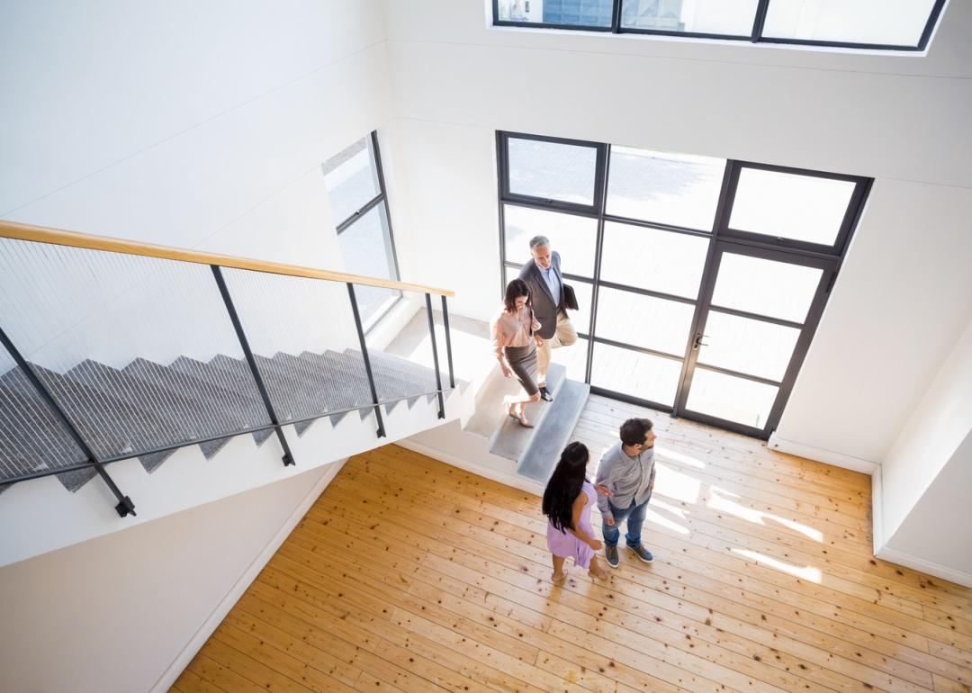 Realtor showing property to prospective buyers.