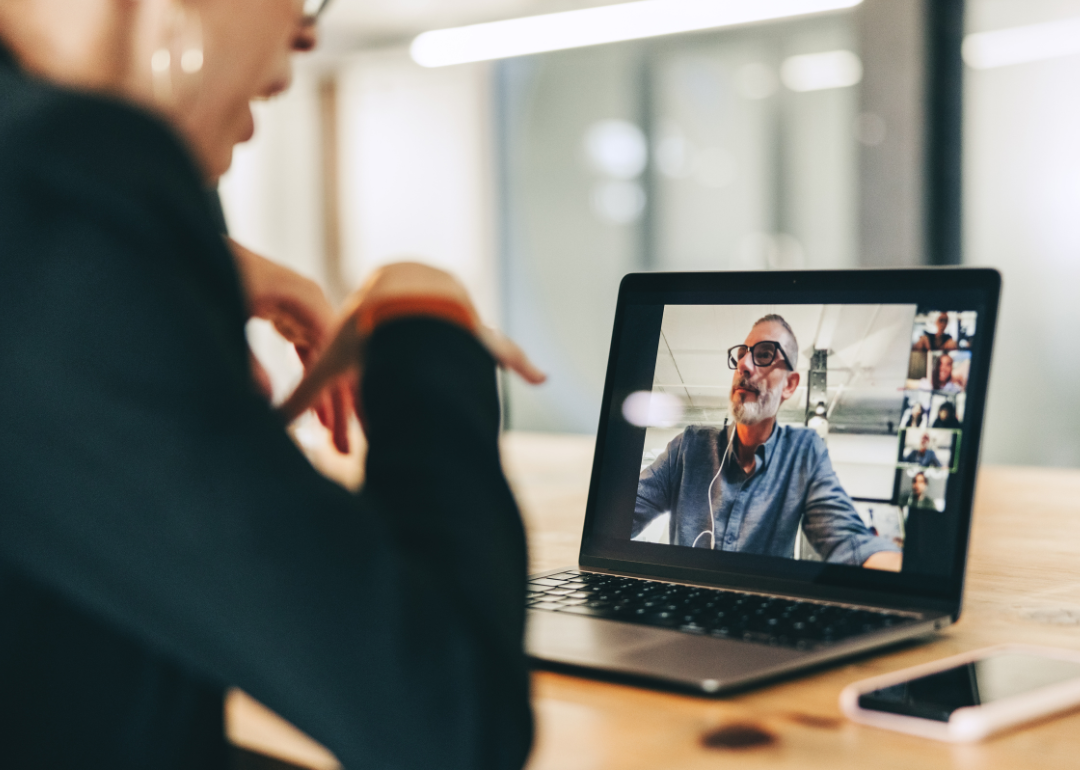 Businesspeople speaking in virtual meeting.