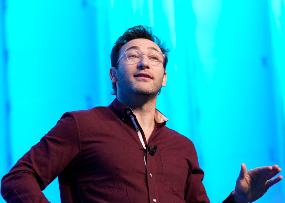 Simon Sinek speaks on stage
