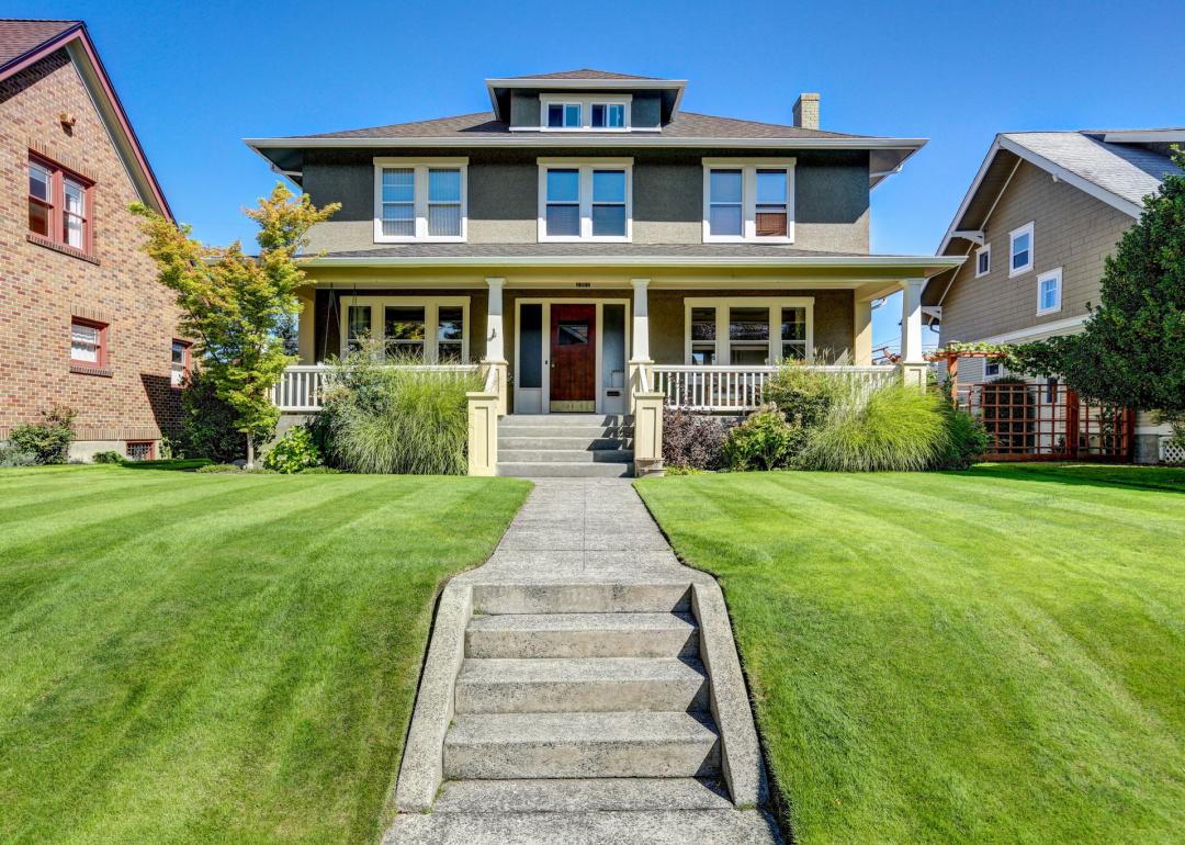 Craftsman-style house with column porch.