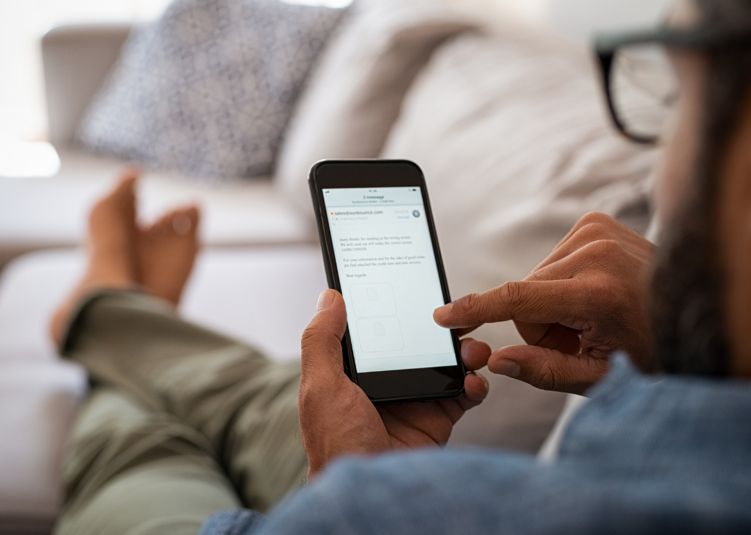 Person reading emails at home.