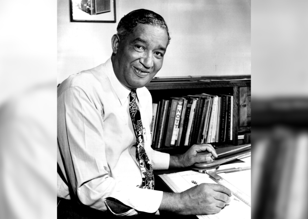 Portrait of Frederick McKinley Jones seated at desk.