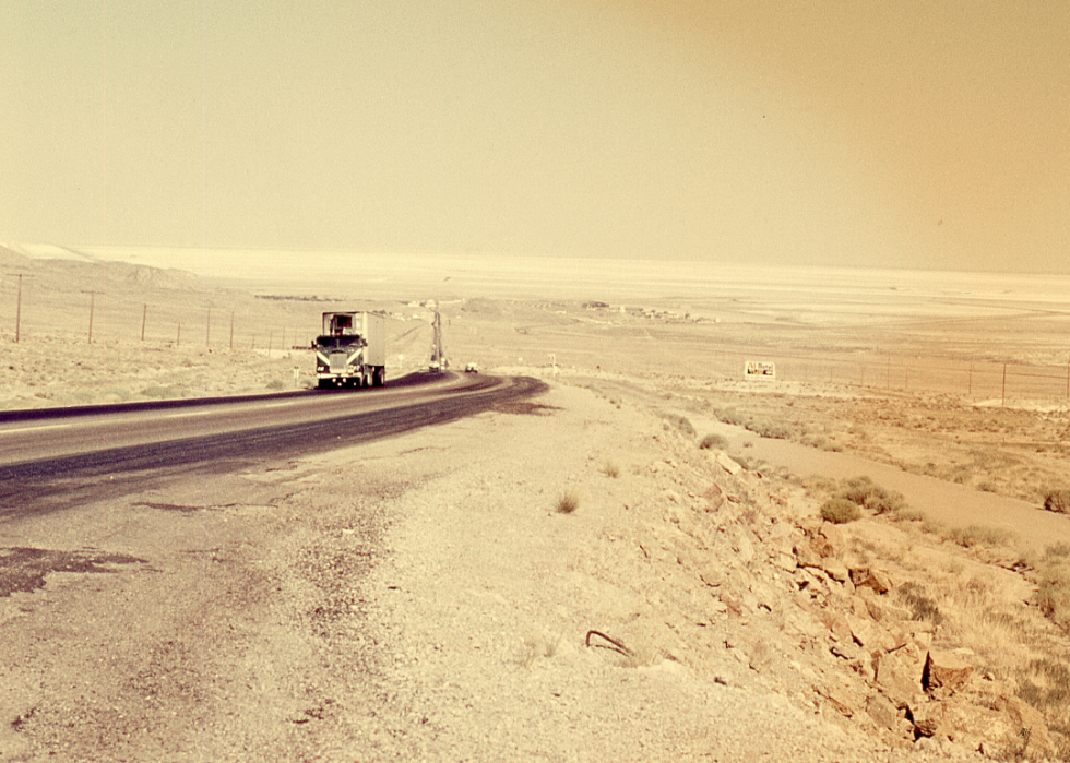 18-wheeler cargo truck driving through the desert.