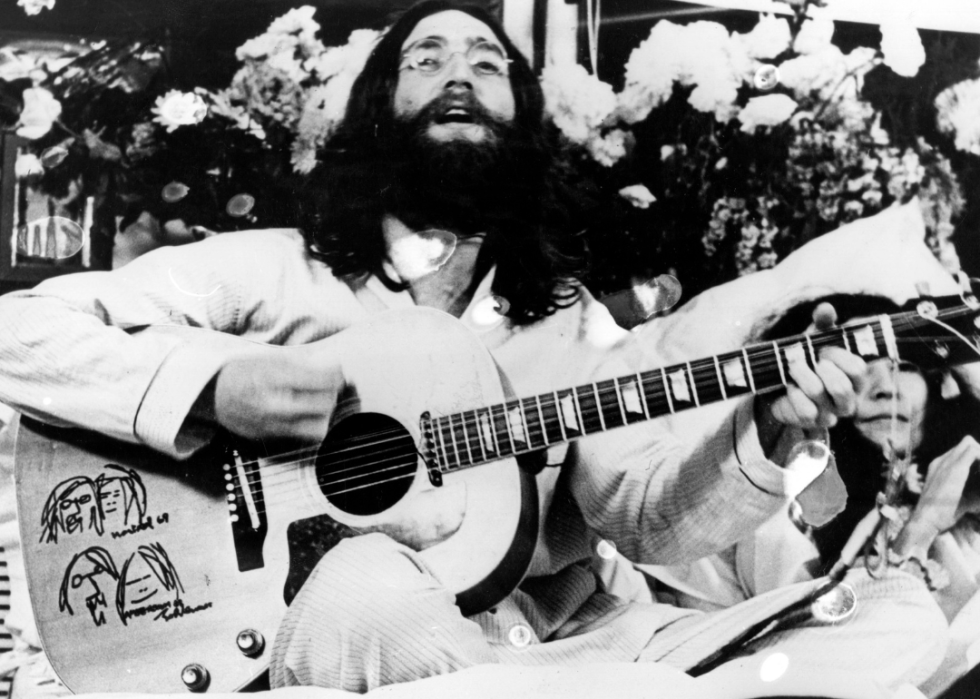 John Lennon and Yoko Ono playing music during bed in.