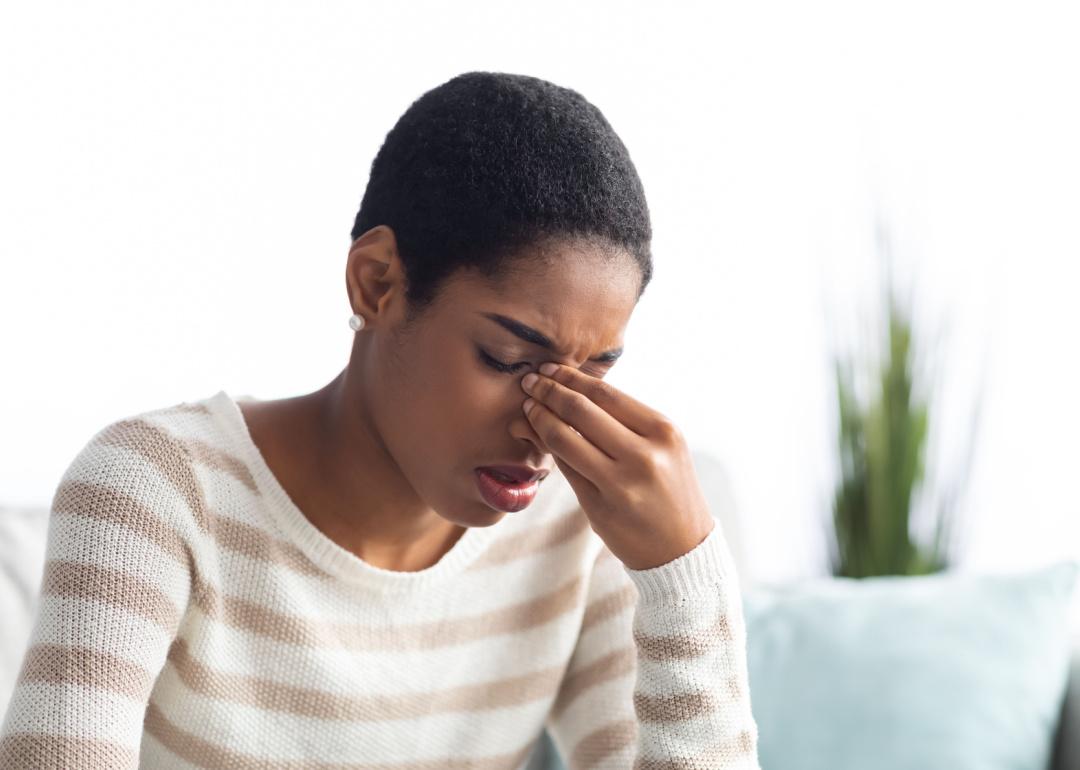 Woman suffering from sinus headache.