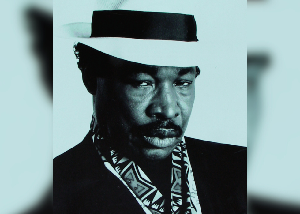 Black and white promotional portrait of Rudy Ray Moore.