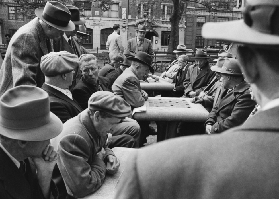 Men playing checkers in park