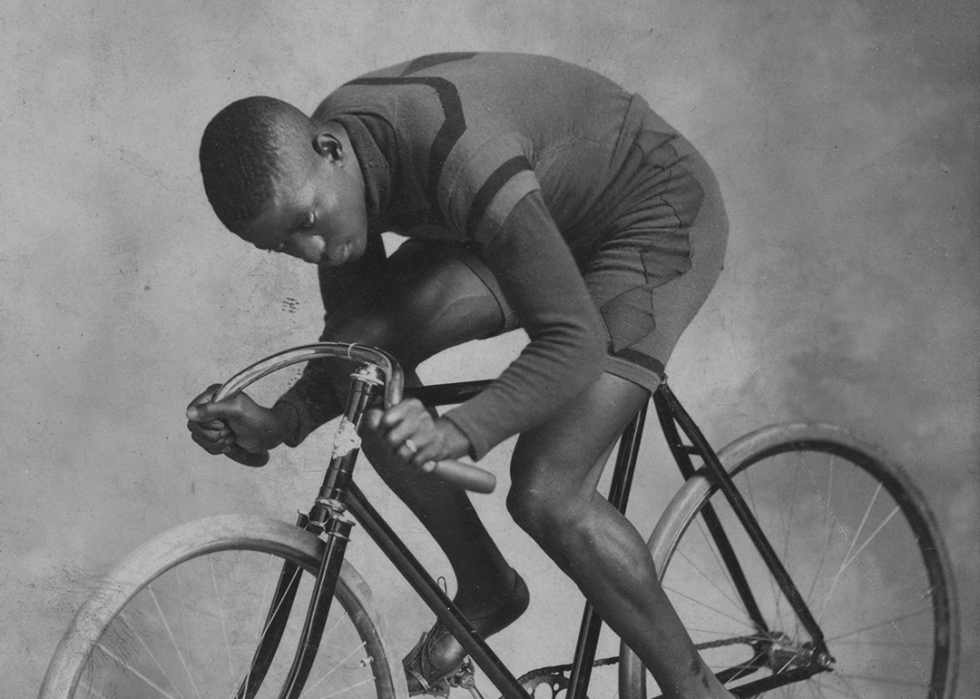 Marshall "Major" Taylor seated on a bicycle.