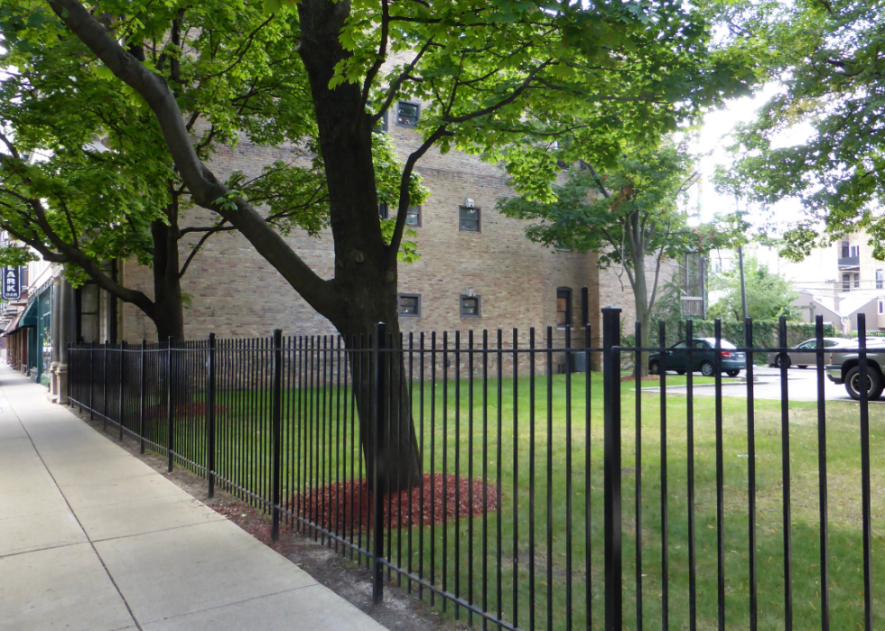 Iron fence around vacant lot.