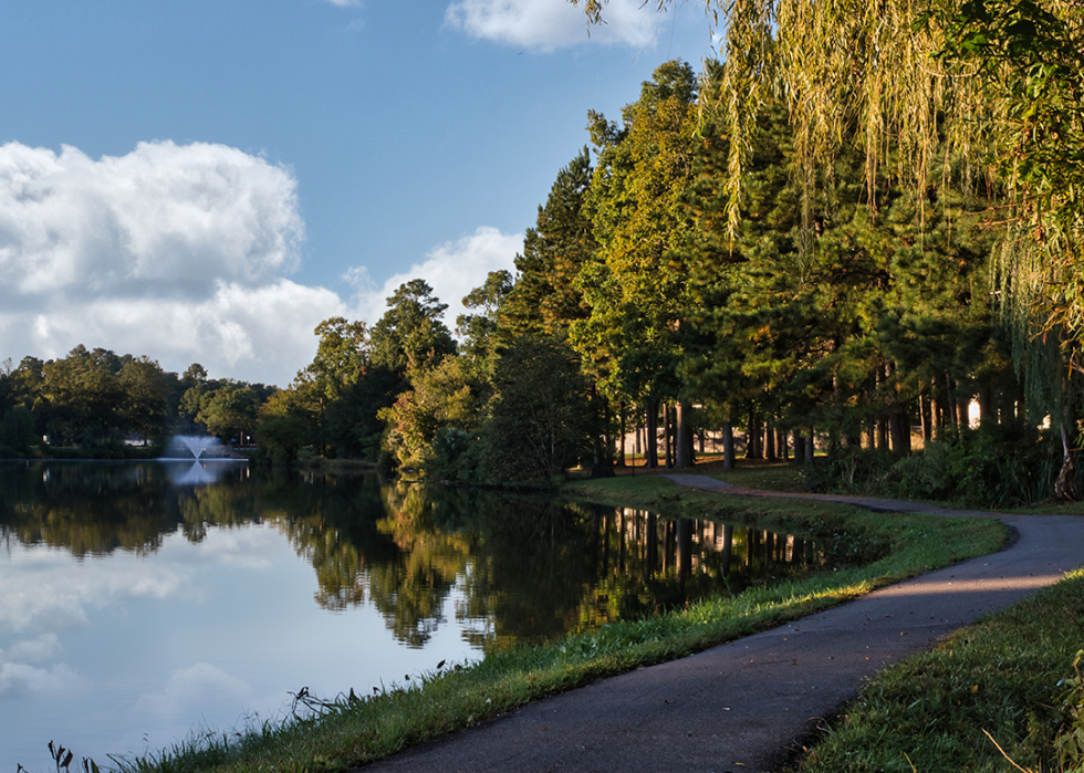 Walking path and lake with fountain in Innsbrook.