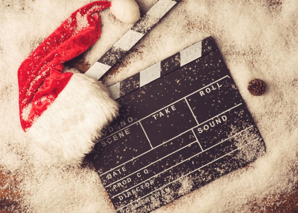 Christmas hat with film clapper in the snow.