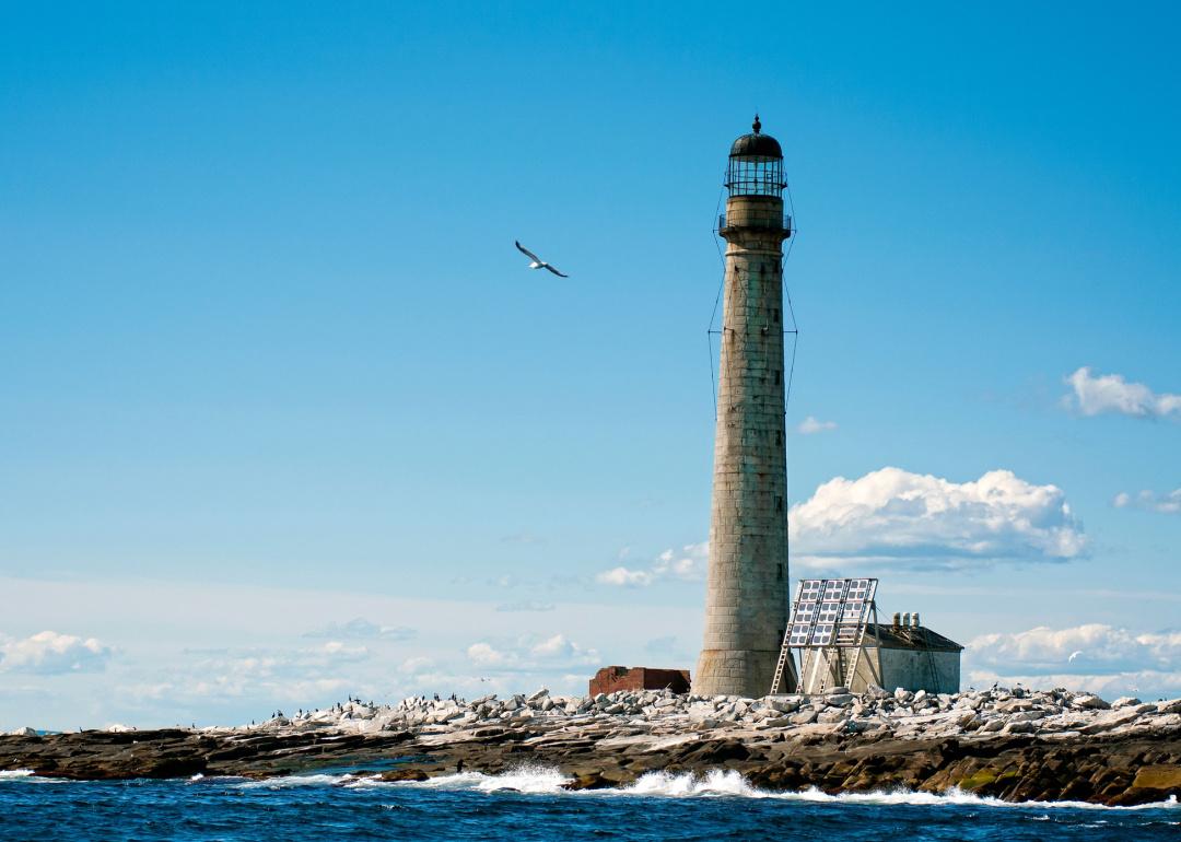 Stone tower of Boon Island lighthouse on summer day.
