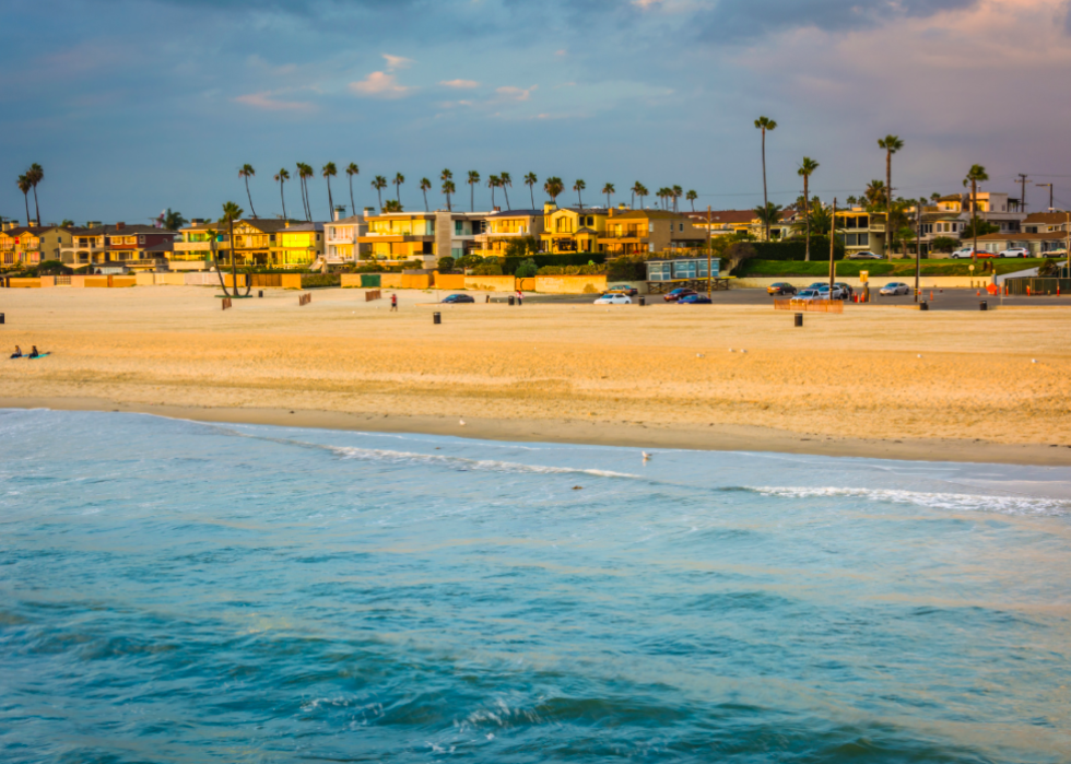 Waves in the Pacific Ocean and the beach at sunset in Seal Beach, California