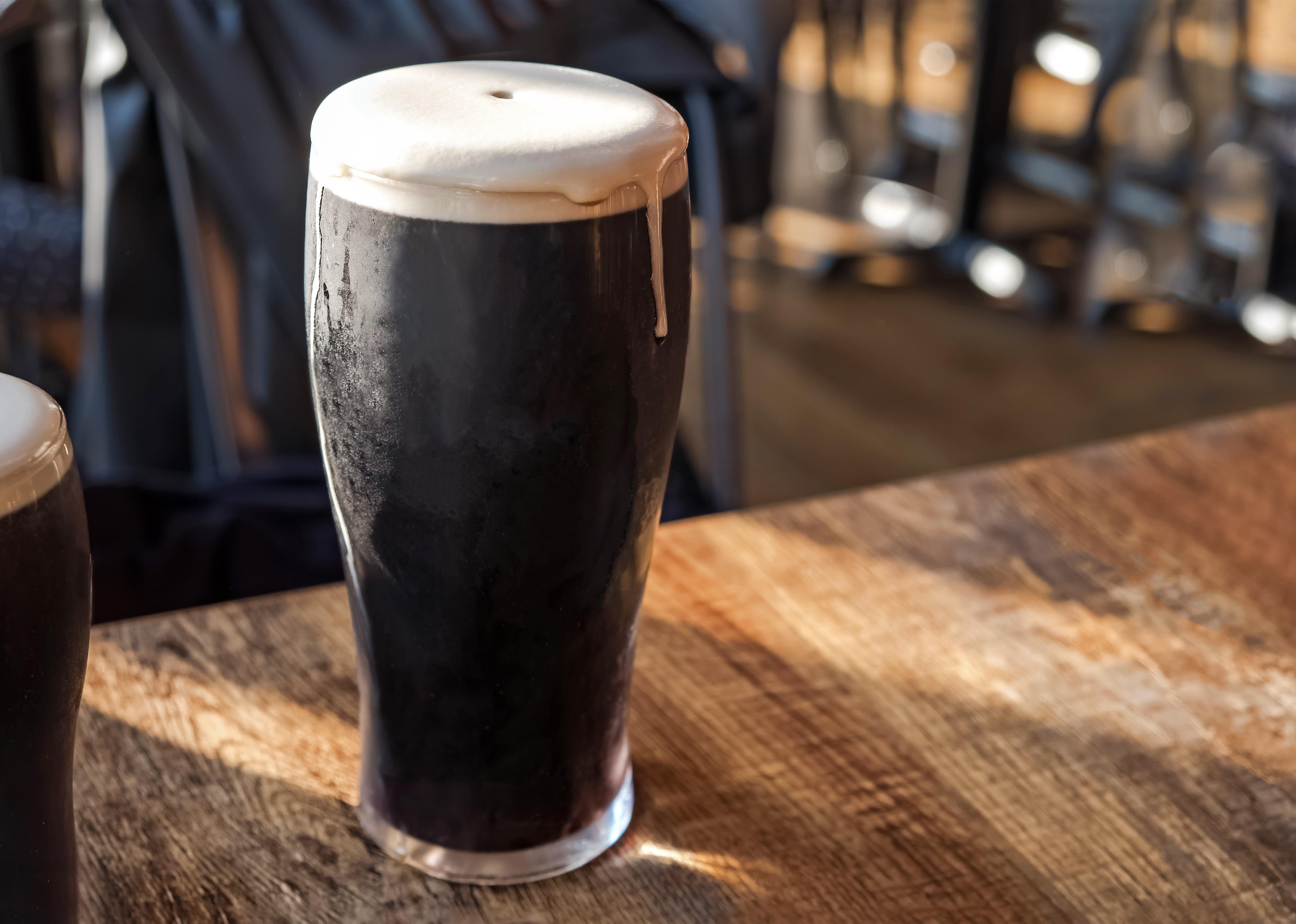 Cold, refreshing glass of stout shown close-up.