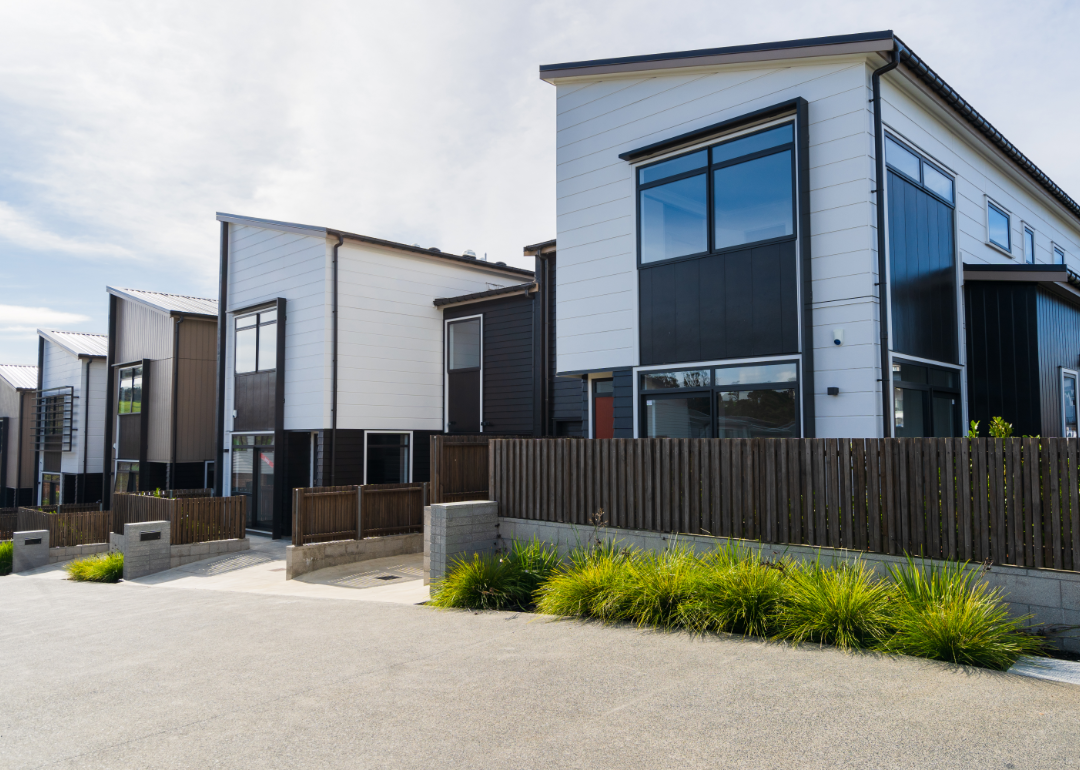 A row of four identical modern homes