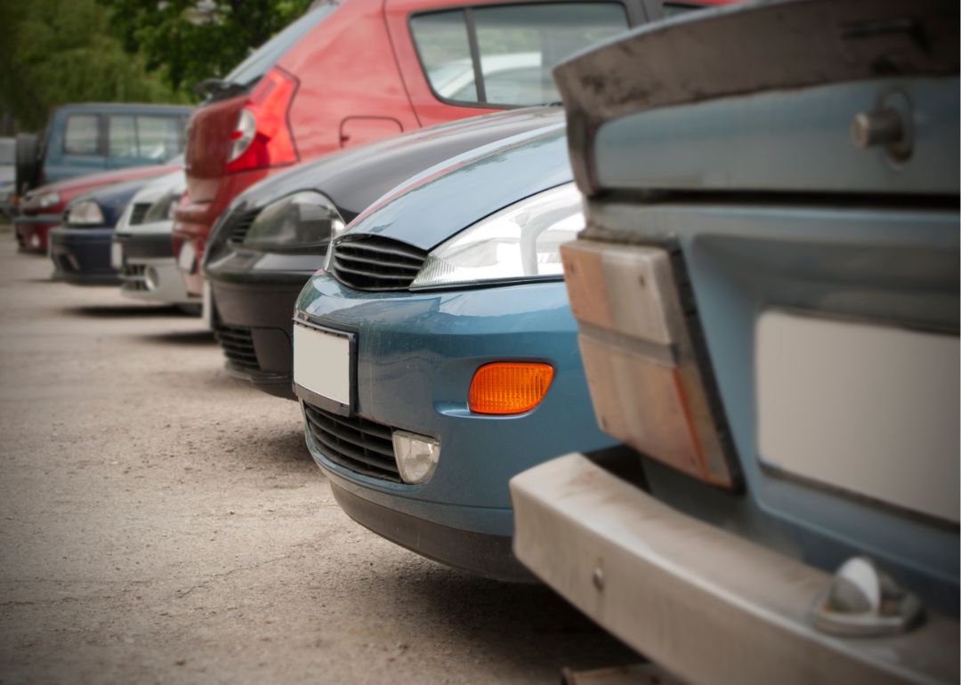 Used cars lined up in a parking lot.
