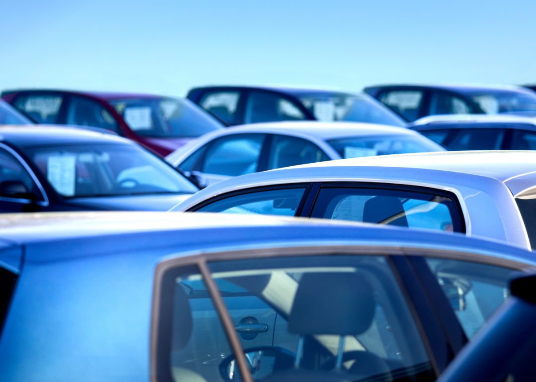 View across the roofs of multiple parked cars.