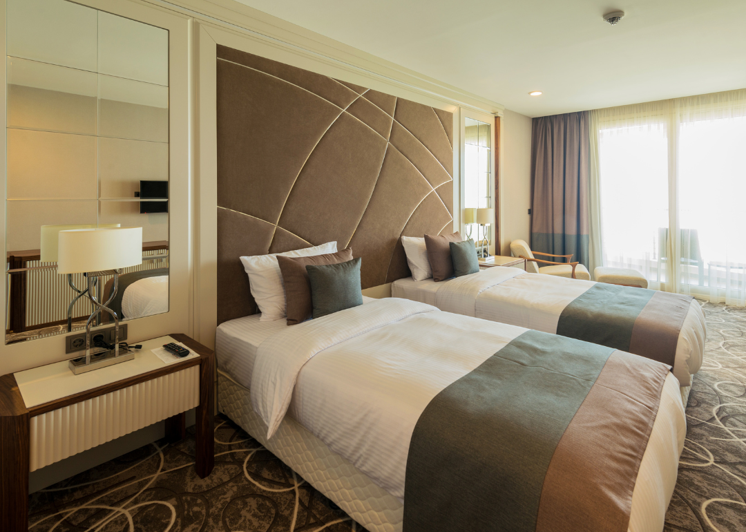 A hotel room with two double beds.