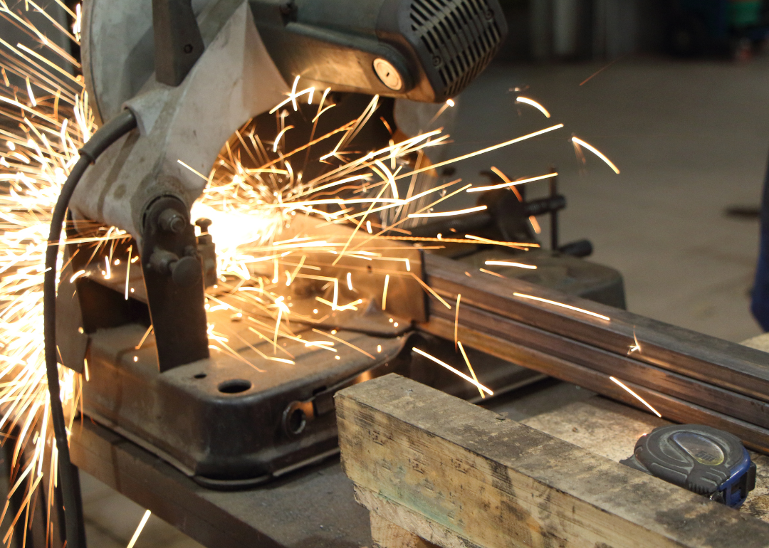 A metal tool is welded in a factory.