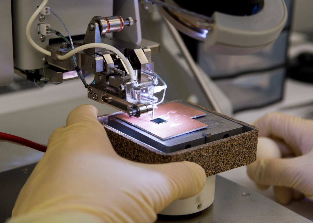 A silicon semiconductor chip being wirebonded.