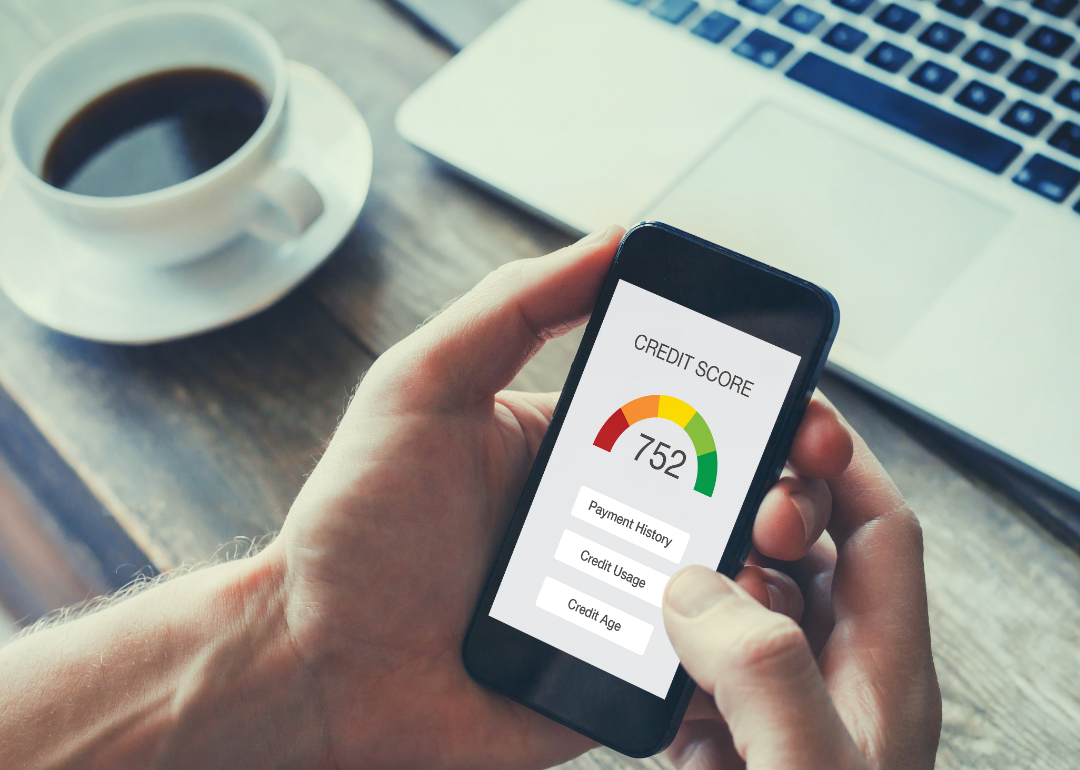 A credit score being displayed on a smartphone.