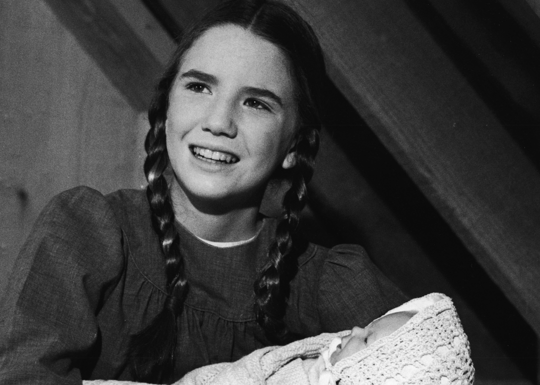 Melissa Gilbert filming a scene with a baby in the 1970s.