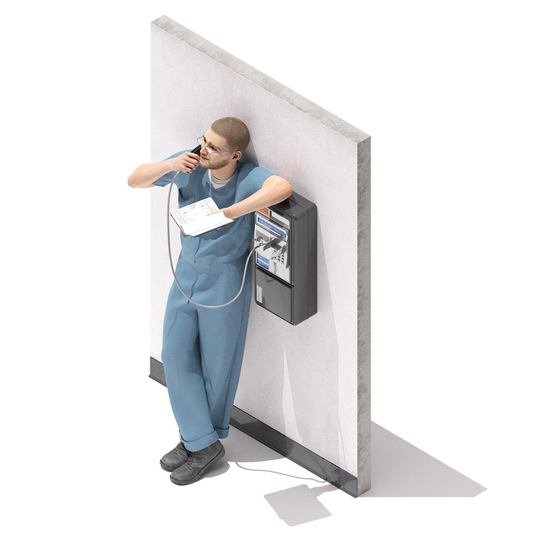 A man leans against a wall while talking on a payphone and holding a book.
