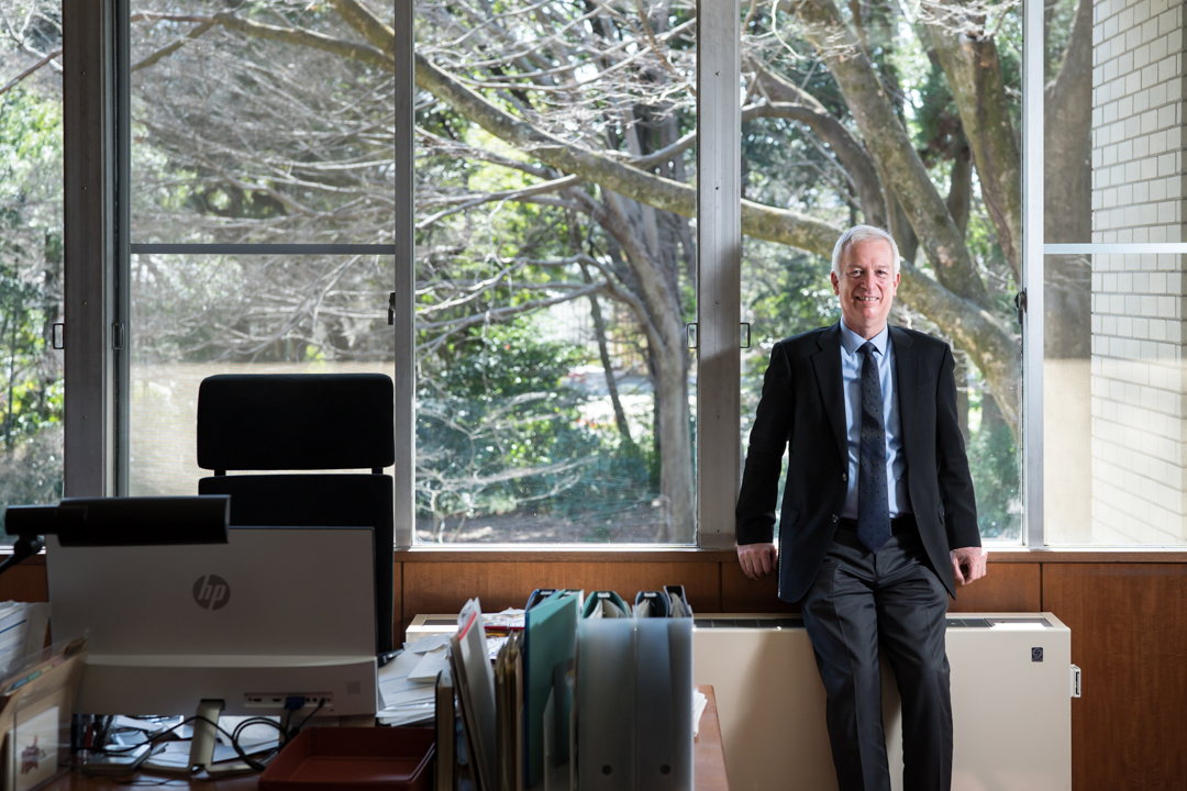 A man stands in an office.