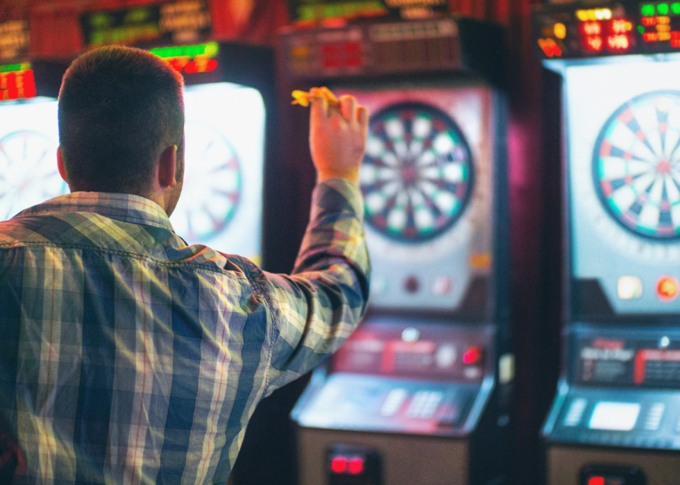 Man plays darts