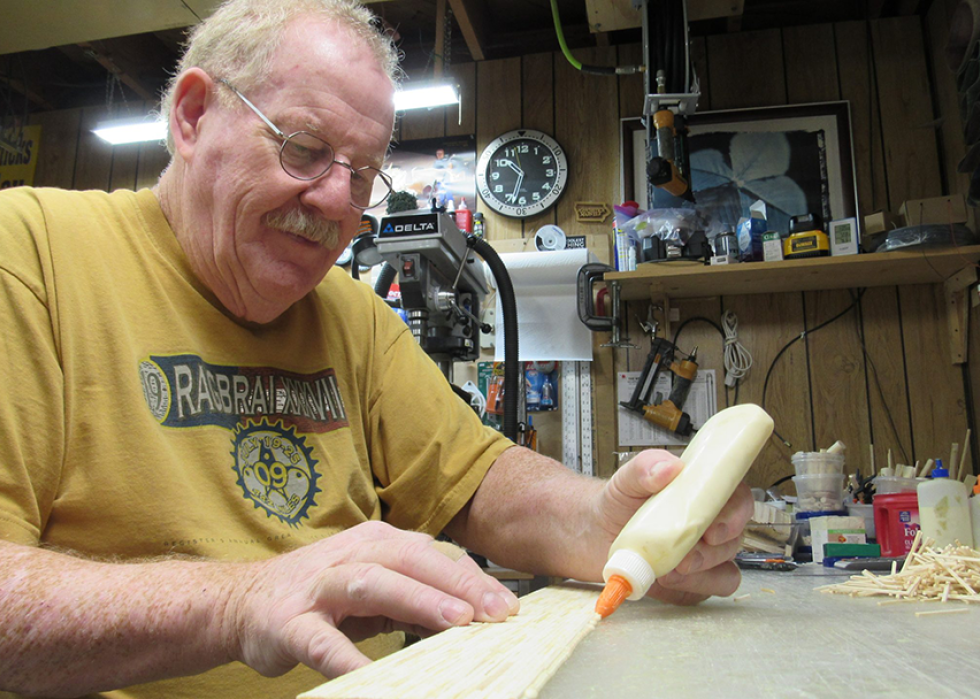 Pat Acton at work in his basement workshop.